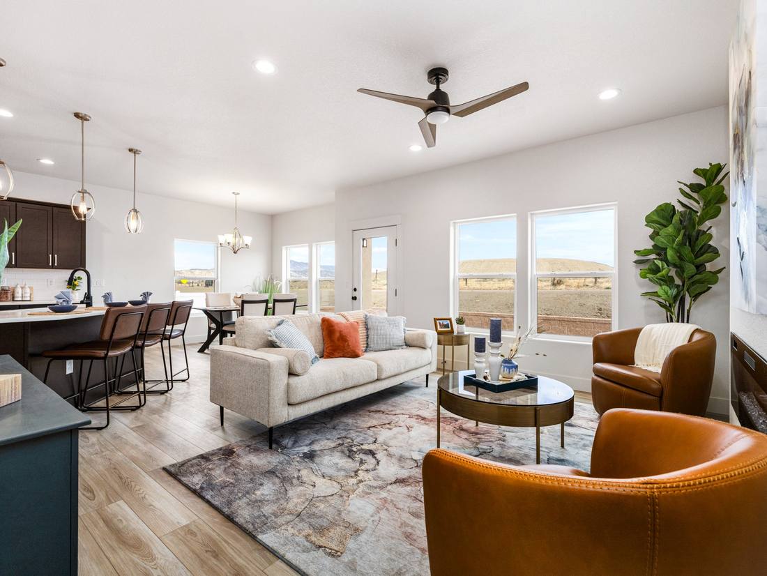 Open great room and kitchen with windows onto open country